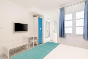 TV a/nebo společenská místnost v ubytování Monza House Otel