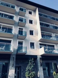 a tall building with balconies on the side of it at Residence The Catalogne in Font-Romeu