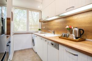 a kitchen with a sink and a counter top at Apartment DOLCE CASA in Varna City