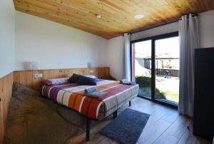 Postel nebo postele na pokoji v ubytování La Granja del Besa + 44 fotografií