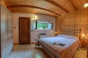 Postel nebo postele na pokoji v ubytování Villa dei Pini