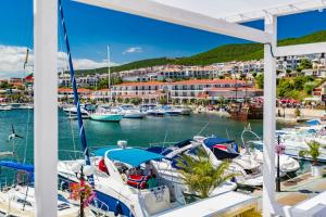 a view of a marina with boats in the water at Delfin Port Apartments - Prime Location & Parking & Pet Friendly in Sveti Vlas