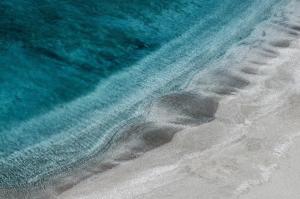an overhead view of the beach and the ocean at Agia Kyriaki Studios in Agia Kiriaki Beach