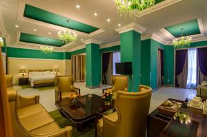 a hotel room with green walls and a bed at Phoenicia Boutique Hotel - Adults Only in Mamaia Sat/Năvodari +82 photos