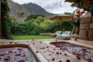 a bath tub filled with lots of flower petals at Pisac Inn in Pisac