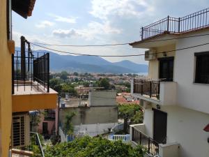 a view of a city from between two buildings at Elpida Apartment in Limenas