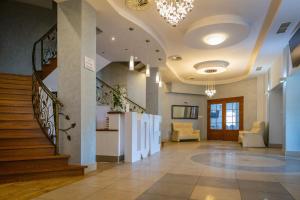 a lobby with a staircase and a stair case at Siódme Niebo in Kutno