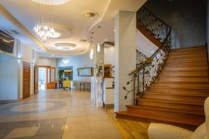 a hallway with a staircase in a house at Siódme Niebo in Kutno