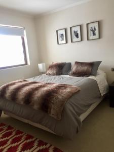 a bedroom with a large bed and a window at Apartment Valle Nevado in Valle Nevado