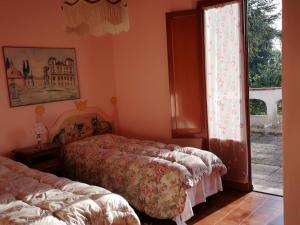 Posteľ alebo postele v izbe v ubytovaní Villa Artemisia