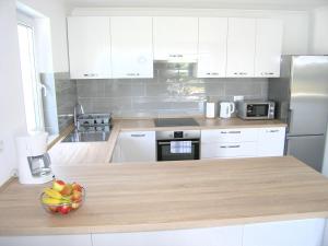 Kuchyňa alebo kuchynka v ubytovaní Apartmani Krajinovic