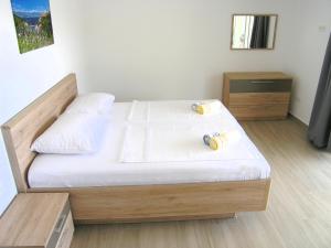 Posteľ alebo postele v izbe v ubytovaní Apartmani Krajinovic