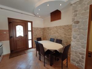 a dining room with a table and chairs at Elpida Apartment in Limenas +13 photos