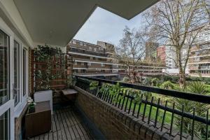 a balcony with a view of a city at Spacious 3 bedroom apt in Covent Garden in London