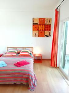 מיטה או מיטות בחדר ב-Casa Luminosa