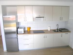 Kuchyňa alebo kuchynka v ubytovaní Apartmani Krajinovic
