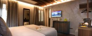 TV a/nebo společenská místnost v ubytování Rosa Salva Hotel