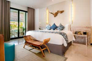 A bed or beds in a room at Montigo Resorts Seminyak
