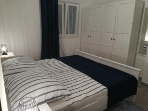 Łóżko lub łóżka w pokoju w obiekcie Apartment ANTONELLA