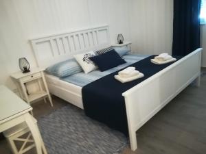 Łóżko lub łóżka w pokoju w obiekcie Apartment ANTONELLA