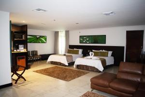Uma televisão e/ou sistema de entretenimento em Studio Hotel Boutique