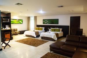 Uma cama ou camas num quarto em Studio Hotel Boutique