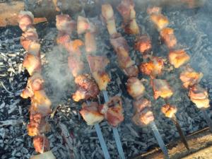 a bunch of food cooking on a grill at Laia's Guesthouse in Khashiti