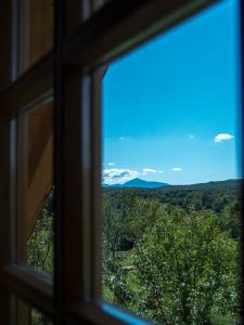 a view from a window looking out at the mountains at Holiday Homes Eko Klanac in Rakovica