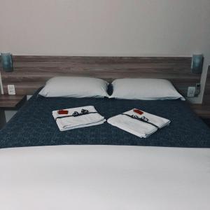 Ένα ή περισσότερα κρεβάτια σε δωμάτιο στο LH Plaza Hotel