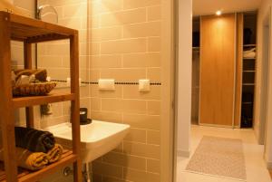 a bathroom with a sink and a mirror at Riga A new designed cosy family apartment in Riga +44 photos