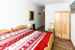Postel nebo postele na pokoji v ubytování Hotel Al Foiron