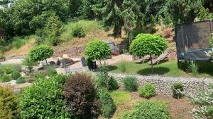 an aerial view of a garden with trees and bushes at Hotel-Gasthof Hüttensteinach in Sonneberg