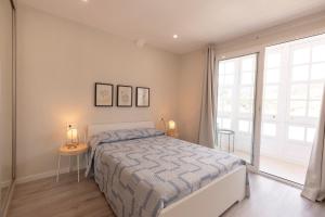 Кровать или кровати в номере Noray Apartamentos Viveiro