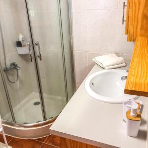 a bathroom with a shower and a sink at eSense - Formosinha in Madalena