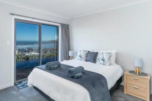 Voodi või voodid majutusasutuse Kaka Point Views Apartment 1 toas