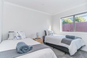 Voodi või voodid majutusasutuse Kaka Point Views Apartment 1 toas