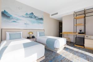 Voodi või voodid majutusasutuse The Parc Hotel toas