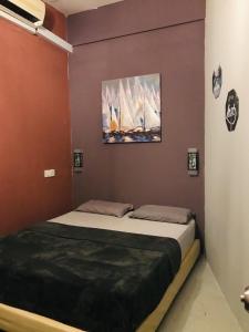 Ein Bett oder Betten in einem Zimmer der Unterkunft Borneo Sweet Guesthouse