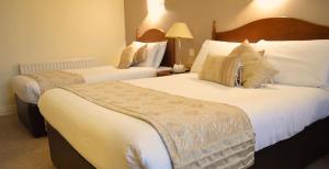 Ліжко або ліжка в номері Hotel Curracloe