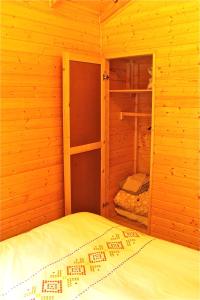 A bed or beds in a room at Camping Abadesses