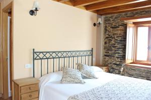 Postel nebo postele na pokoji v ubytování Casa Rural Soutomoro