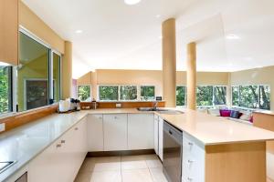 A kitchen or kitchenette at The Sanctuary Little Cove