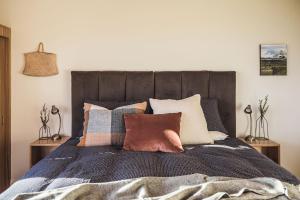 מיטה או מיטות בחדר ב-Whitimanuka Retreat