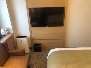 Postel nebo postele na pokoji v ubytování Kobe Luminous Hotel Sannomiya