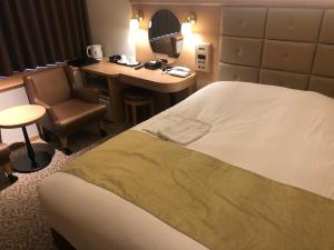 Postel nebo postele na pokoji v ubytování Kobe Luminous Hotel Sannomiya