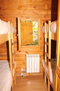 A bed or beds in a room at Camping Abadesses