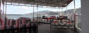 a room with chairs and a view of the water at MIO Hotel in Quy Nhon