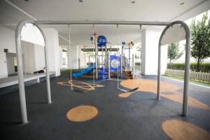 a gym with a swing set and a playground at SetiaWalk {BIG GROUP} 2CARPARK 3ROOM WIFI 5min LRT in Puchong