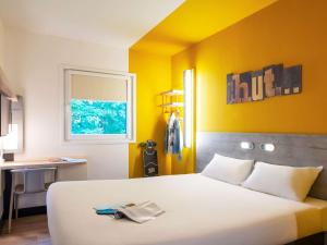 Postel nebo postele na pokoji v ubytování ibis budget Amsterdam Airport
