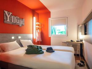 Postel nebo postele na pokoji v ubytování ibis budget Amsterdam Airport